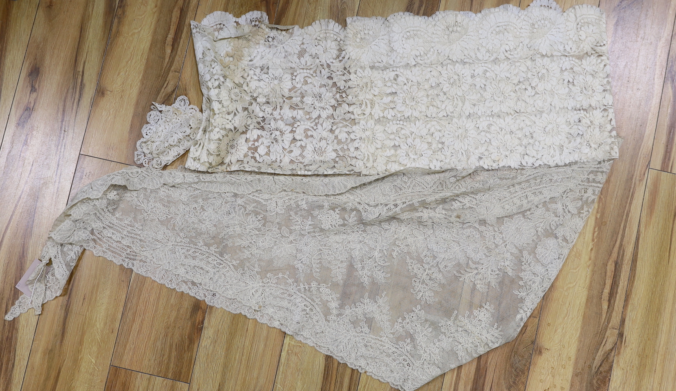 Two pieces of machine lace and a Honiton lace table mat